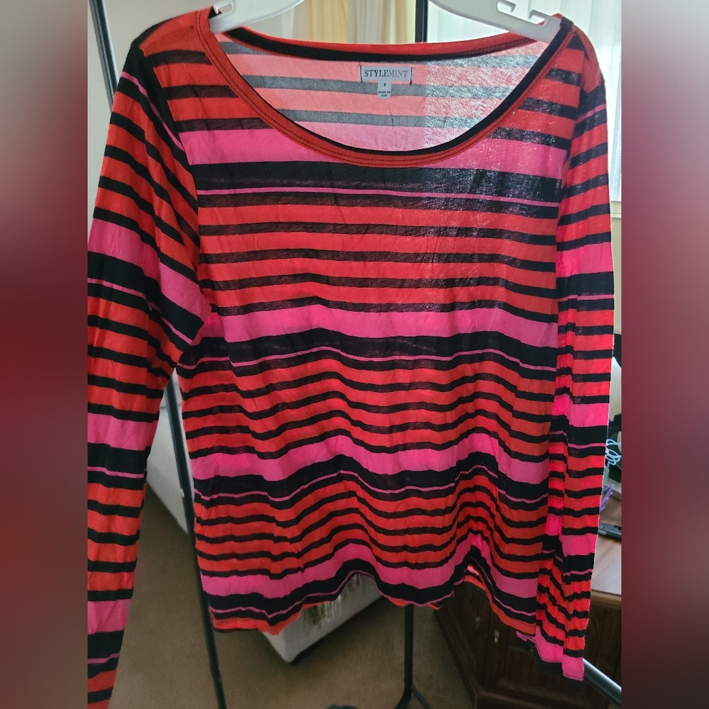 Never worn light weight, long sleeve striped tee.  Slight flare cut
